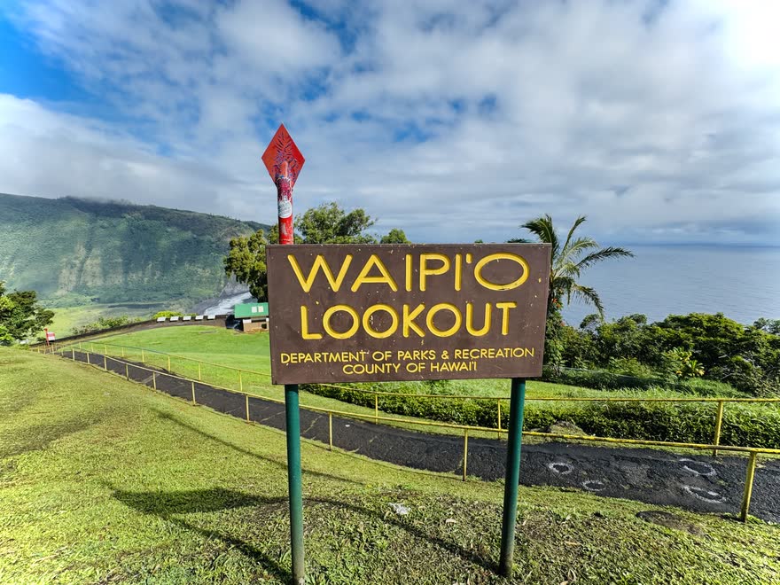 The Waipiʻo Lookout sign above the valley