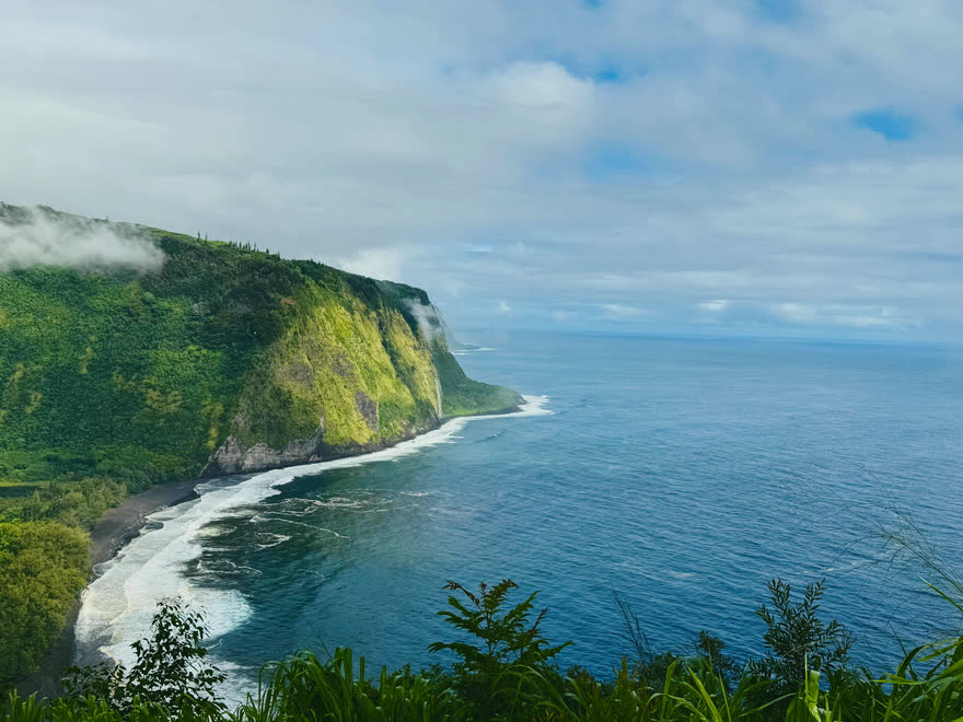 Waipiʻo Valley and its black-sand beach seen from the lookout