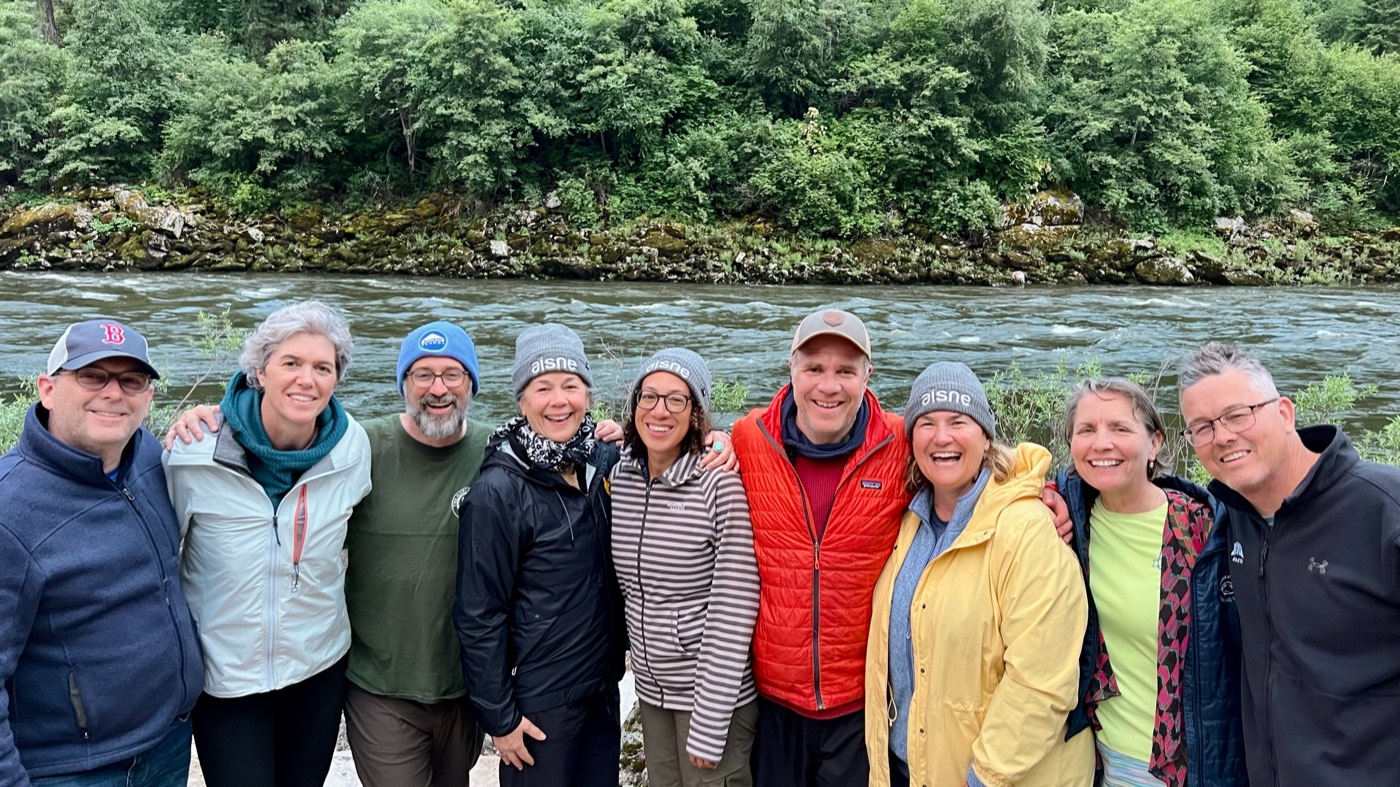 A group of heads of school on the riverbank