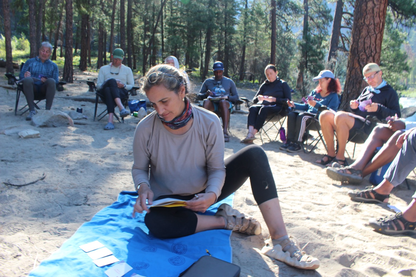 Heads of school in a morning reflection circle on the beach
