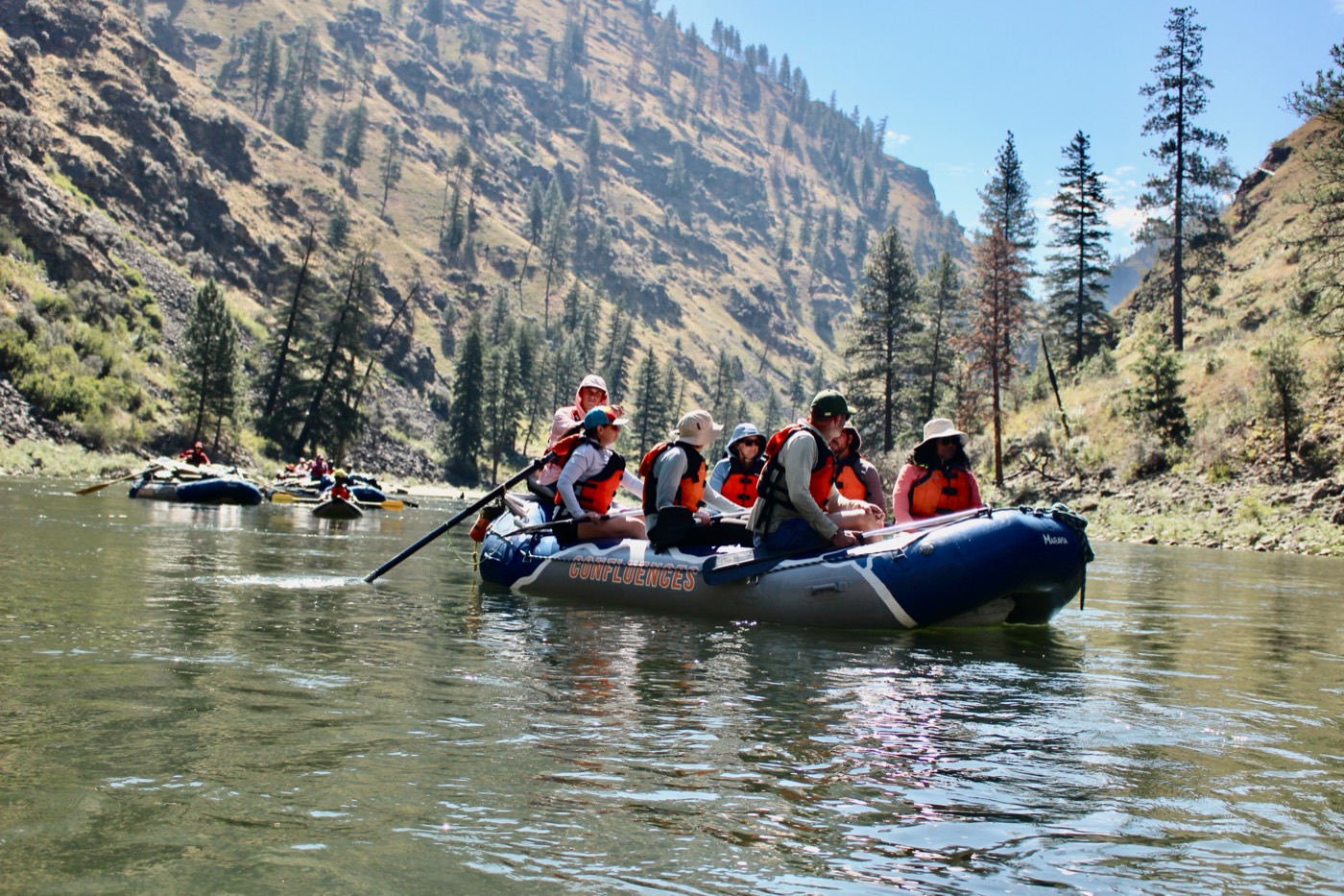 A raft of heads of school floating through the Salmon River canyon